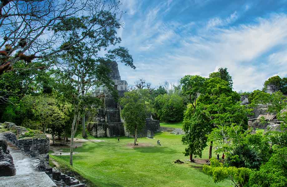 The serene yet grand Tikal pyramids, representing just the tip of the iceberg of Mayan ruins hidden throughout the Guatemalan jungle.