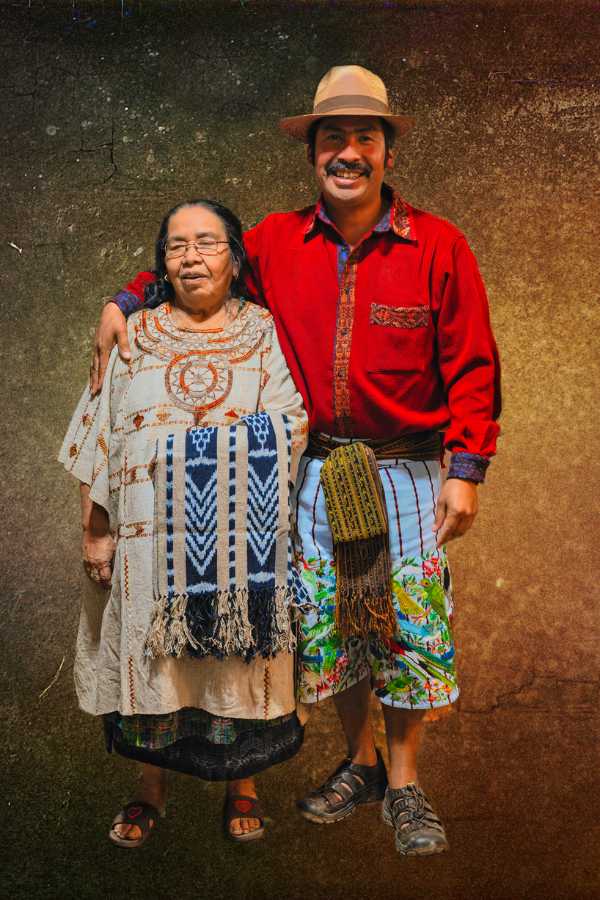 "Maya couple in traditional attire - A beautiful representation of the cultural diversity and colorful traditions of San Juan la Laguna and Santiago Atitlan in Guatemala."