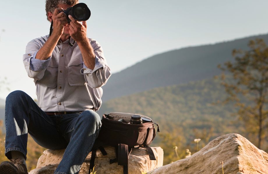 A photographer in action capturing stunning landscapes during a Central America tour.