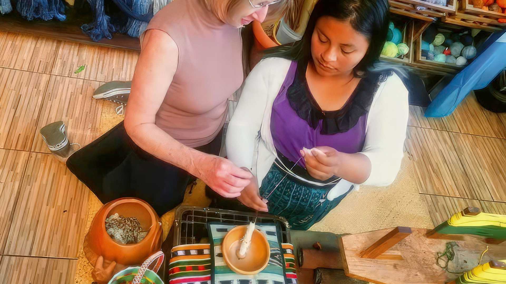 Lady engrossed in a textile experience, discovering the ancestral art of weaving, as an enriching part of the Guatemala Wellness Tour