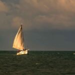 Scenic sunset sailboat cruise featured in our Belize tailor-made vacation package