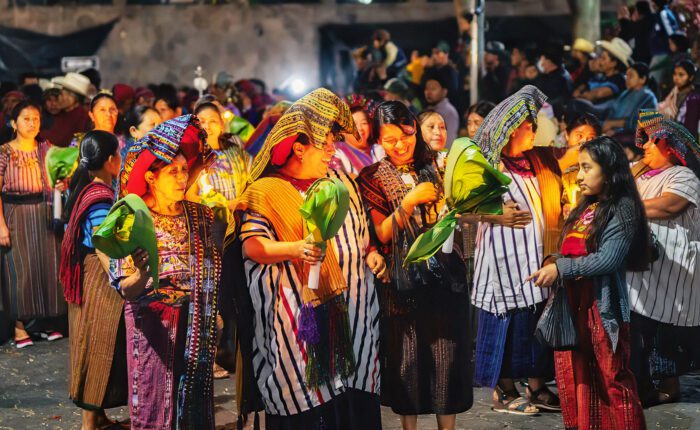 Cultural Immersion Guatemala: Maya women in ceremonial dress celebrating a vibrant festival at Lake Atitlan. Photo by Martsam Travel.