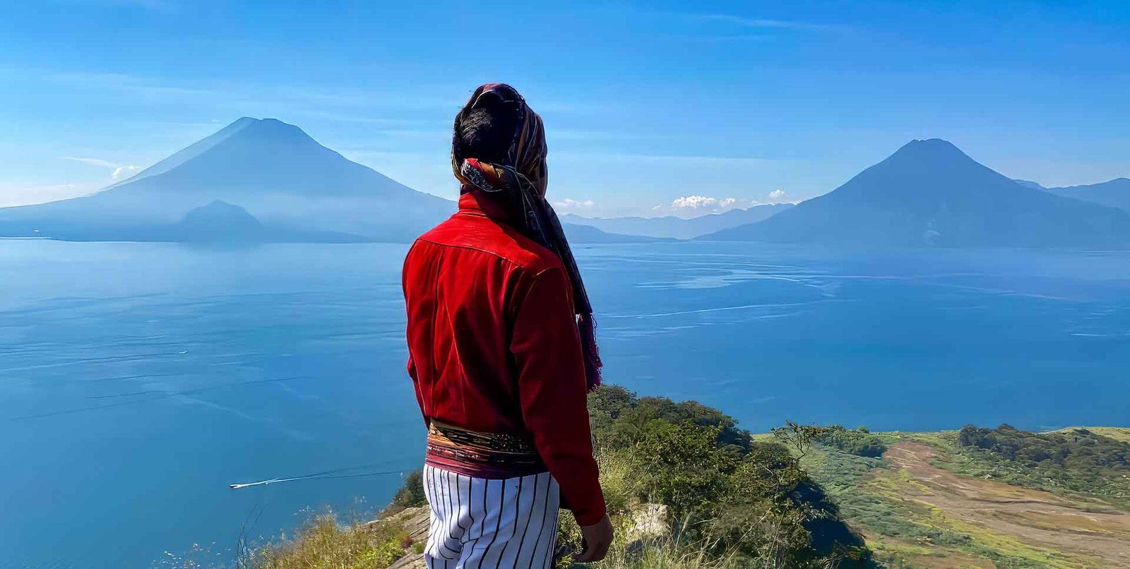 Guatemala-nature-retreat Picture of Lake Atitlan with volcanoes a a Maya man as a part of our Terms and conditions page.