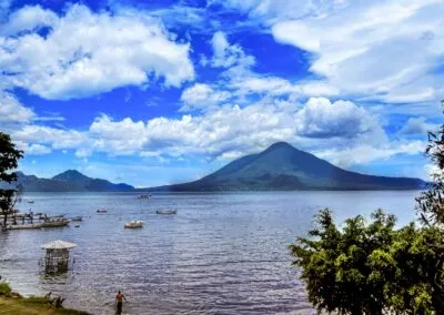 This picture showcases the serene landscape with imponent Lake Atitlan volcanoes, a highlight of our Guatemala Tour.