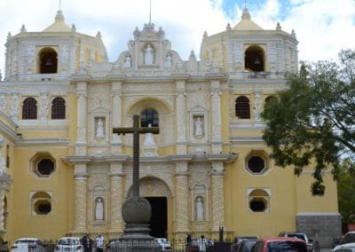 The iconic yellow church La Merced is one of the famous stops of the walking tour in Antigua Guatemala from the Guatemala & Belize tour