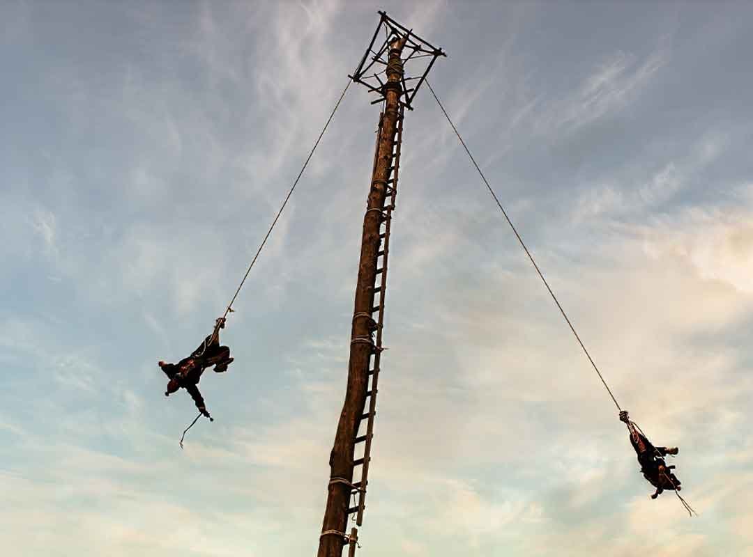 Palovolador | martsam Two young boys performing the Palo Volador at the Chichicastenango Fair in Guatemala, showcasing an ancient Maya ritual.