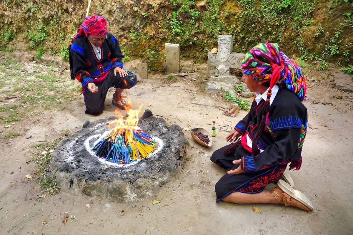Private indigenous tours in Guatemala featuring a Maya fire ceremony with spiritual leaders in Chichicastenango