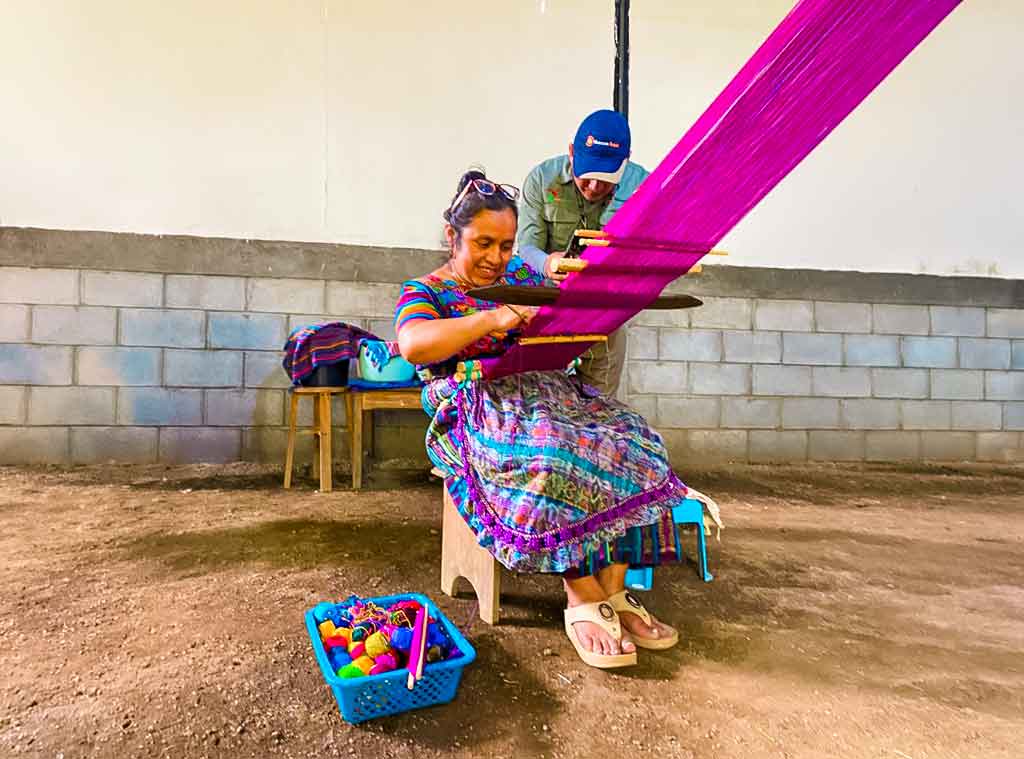 Maya weaver from San Antonio Aguas Calientes working on a backstrap loom, where traditional Maya clothing Guatemala remains part of everyday life and cultural continuity.