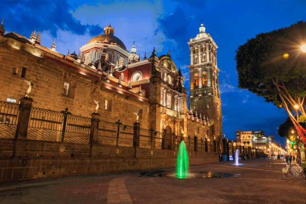 Mexico tour packages featuring Puebla Cathedral, colonial architecture, history, food, and private city tours.