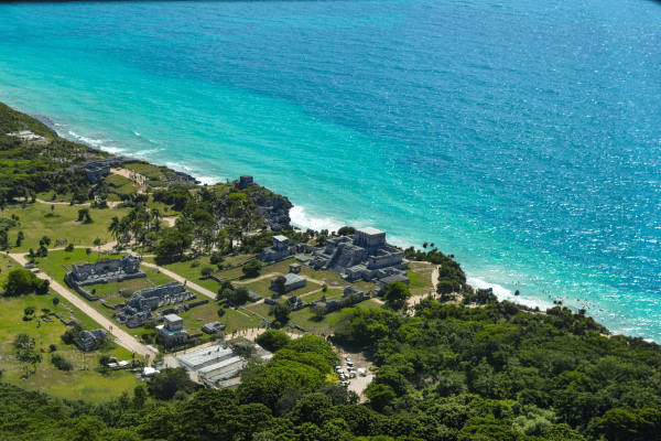 Mexico tour packages featuring Tulum ruins, Caribbean beaches, turquoise water, and Quintana Roo travel.