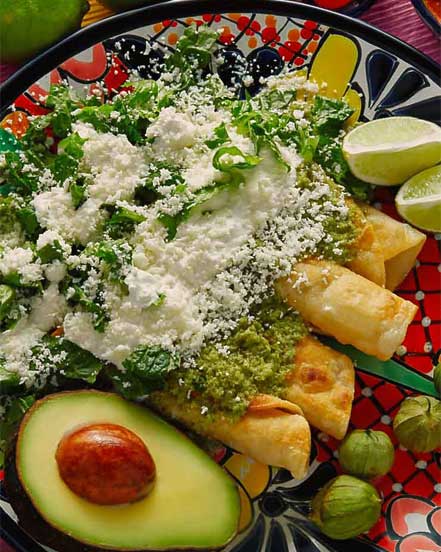Yucatecan food with crispy tacos, avocado, green salsa and fresh cheese featured in Martsam’s Mexico tour packages.