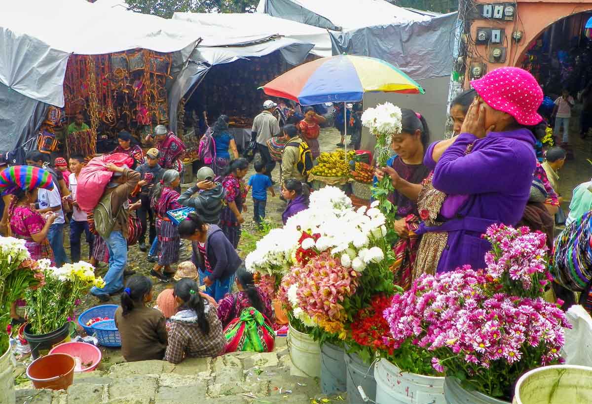 Chichicastenango-market | martsam travel Flower vendors and shoppers at Chichicastenango Market in the Guatemalan highlands