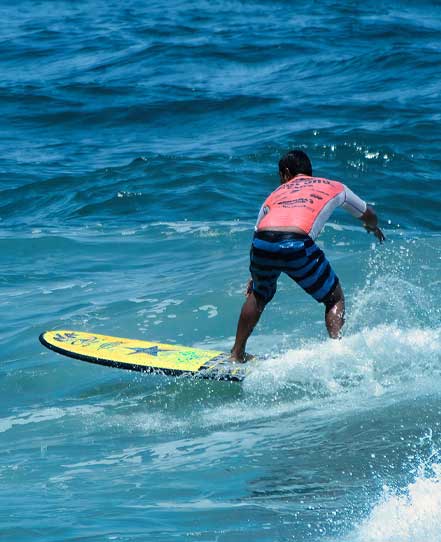 El-salvador-adventure-tour | martsam travel Surfer riding a Pacific Ocean wave during the El Salvador Adventure Tour.