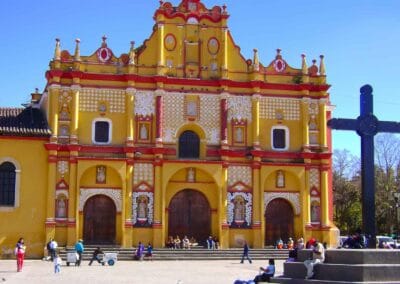 Cathedral of San Cristóbal de las Casas with its yellow-and-red façade, a landmark on a Chiapas Cultural Tour.