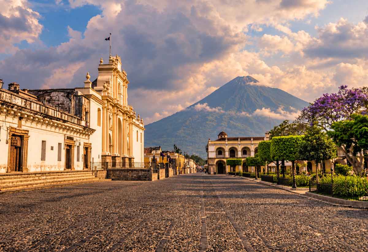 Central Plaza in Antigua Guatemala with Catedral de San José, Palacio de los Capitanes and volcano views for luxury Central America tours