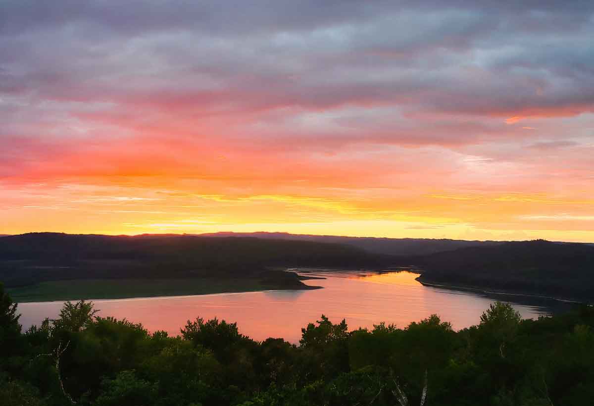 Yaxha-lake-sunset-peten-guatemala | martsam travel Sunset over Yaxhá Lake viewed from the Yaxhá archaeological site in Petén, Guatemala.