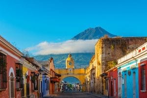 Antigua Guatemala street with the Santa Catalina Arch and Agua Volcano, home of Martsam Travel’s Guatemala office.